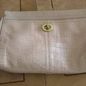 And ivory clutch bag